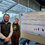 Outreach Dr. Ribeiro and Amanda smile while presenting a research poster titled "Growth Differentiation Factor-15 as a Novel Biomarker for Systemic Inflammation in Transition Dairy Cows" at the Animal Biosciences Research Graduate Student Symposium 2024.